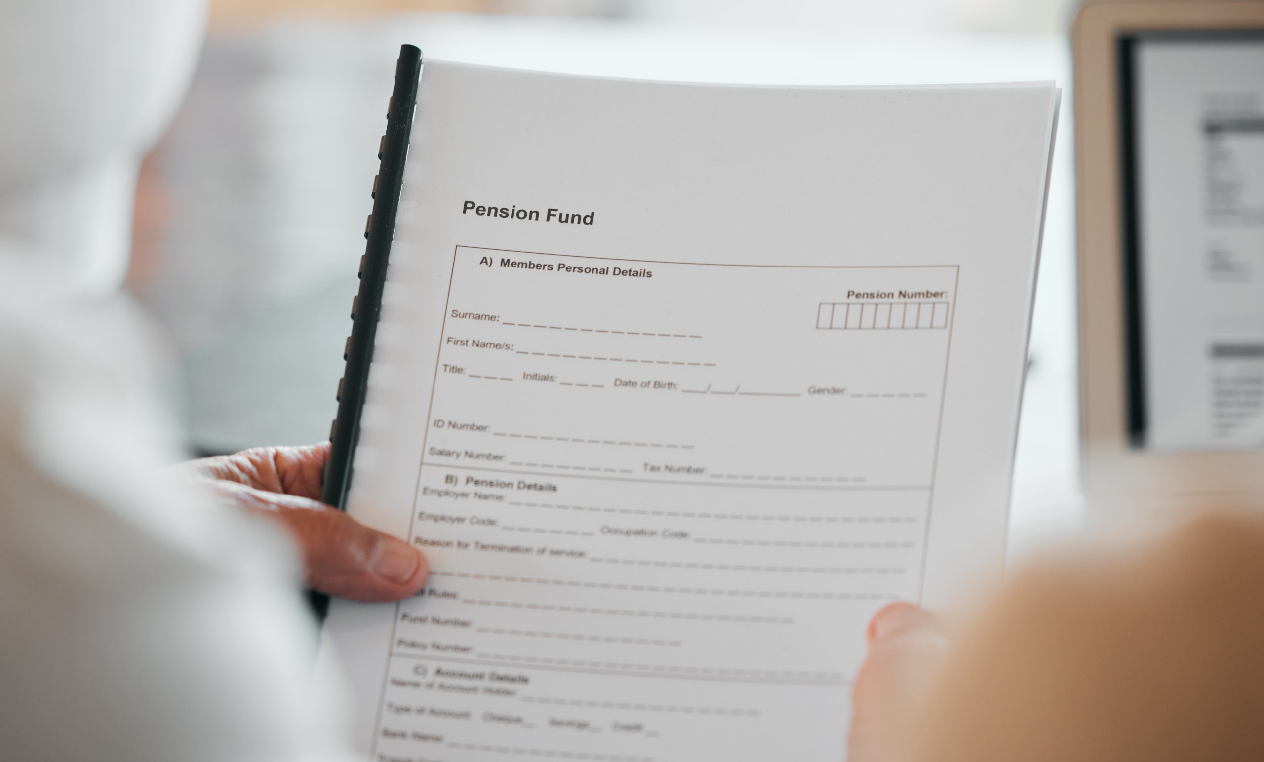 person-hands-and-documents-for-pension-fund-appl-2023-11-27-04-50-04-utc